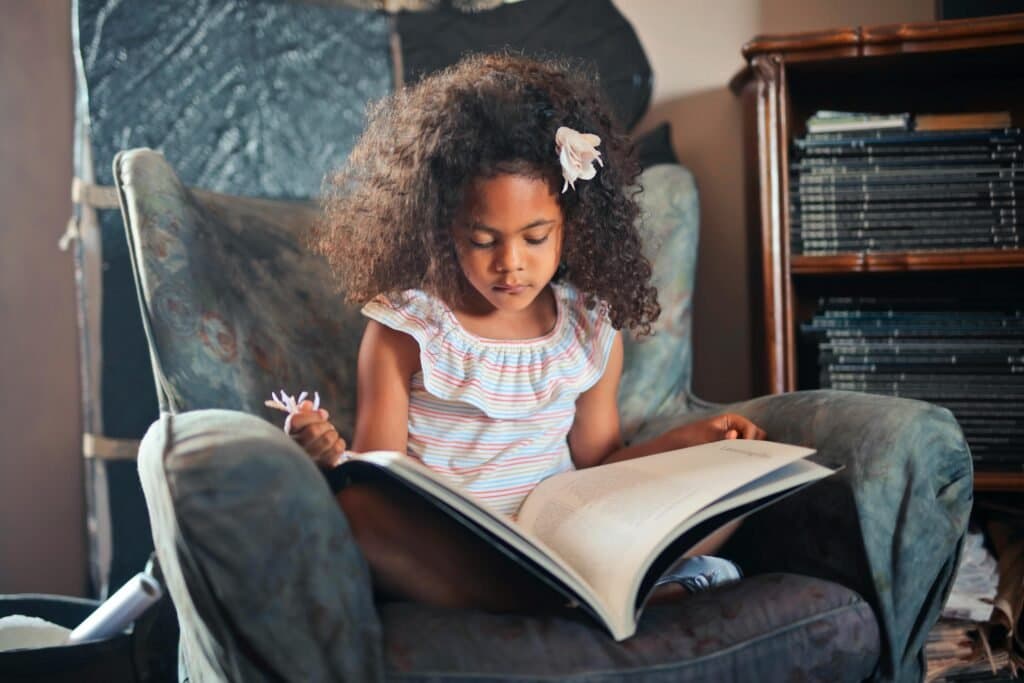 Child developing skills for reading for meaning in South Africa.